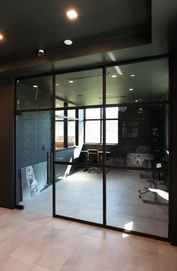 Black-framed glass office enclosure — DJ and Lindsey