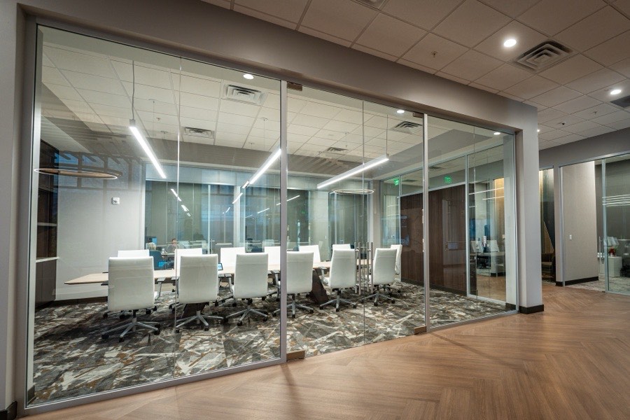 Frameless glass boardroom with marble flooring — Renasant Bank