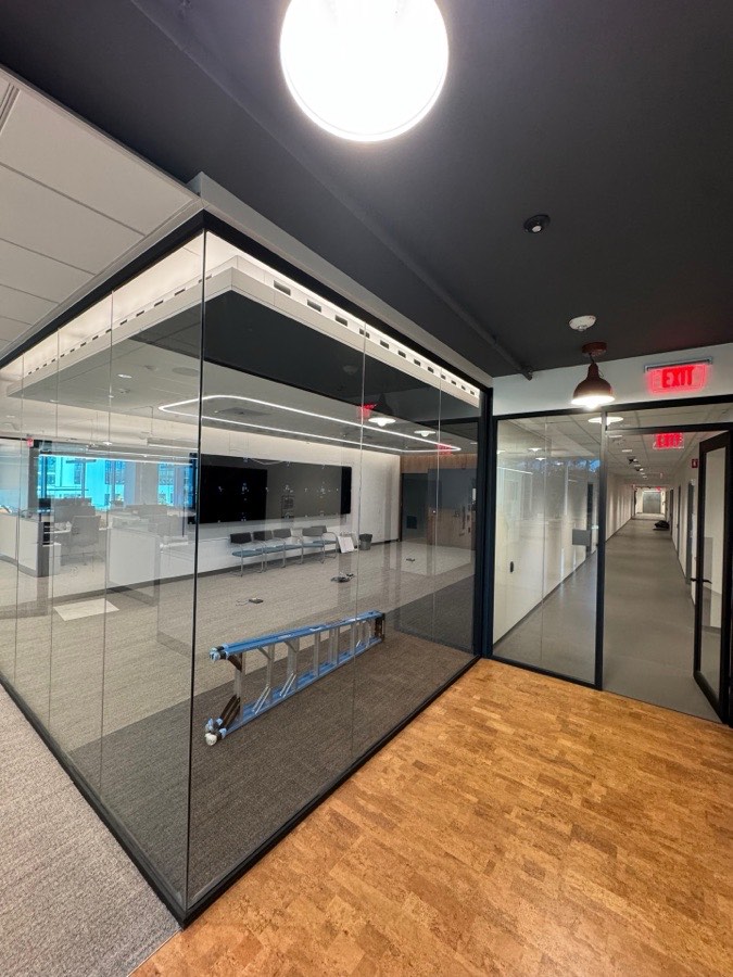 Glass conference enclosure along an office corridor — Mayo Clinic