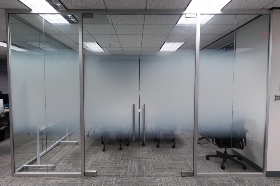 Frosted privacy glass office partition — NLP Logix