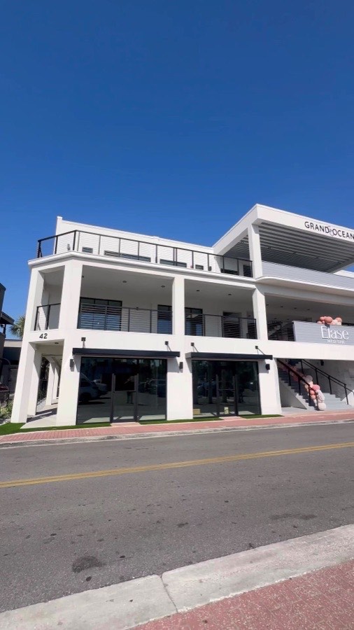 Grand Ocean commercial building with ground-floor glass storefronts