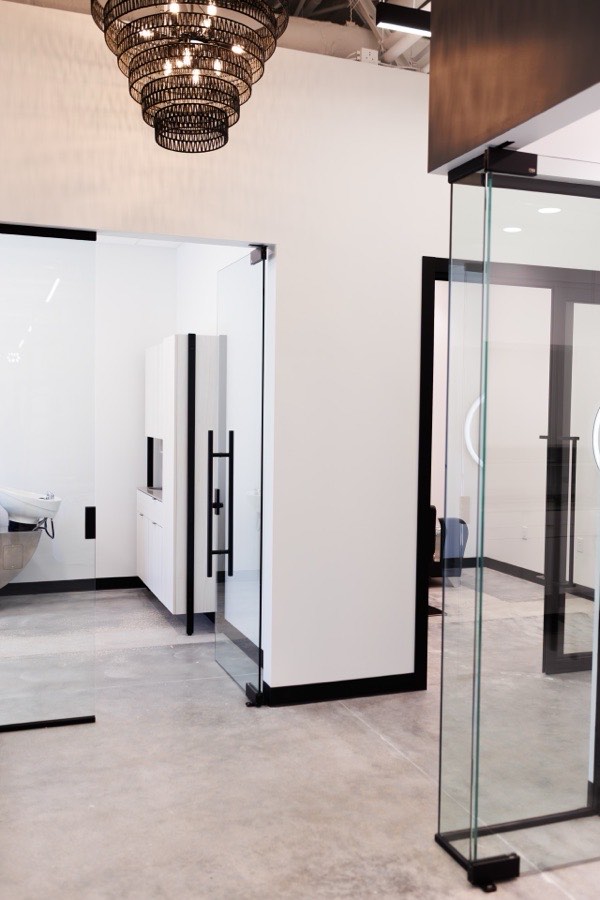 Glass salon suite partitions with chandelier