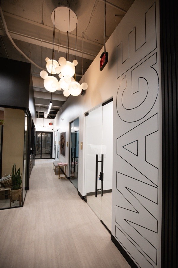 Image Studios corridor with branded wall graphic