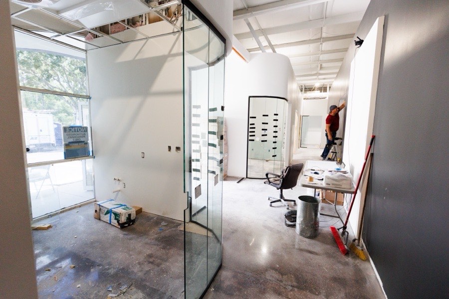 Interior glass installation in progress on a commercial build