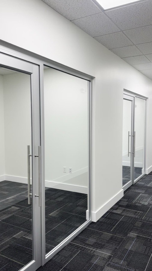 Silver-framed glass office partitions — Petticoat-Schmitt